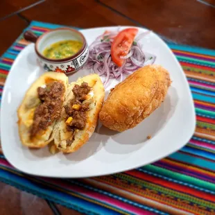 Pàpa rellena has meat stuffing witholive and a boil egg