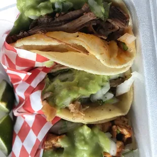 3 tacos! Carnitas, marinated chicken, and marinated pork.... wow taste perfect. Amazing little tacos right here....  Try this place!!!!