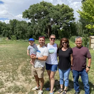 A family visit in front of the famous Alamo (cottonwood tree).