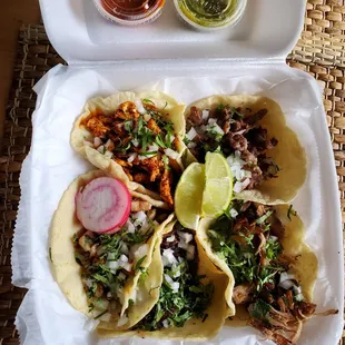 Tacos de barbacoa, suadero, carnitas, chicken and mole, and beef.