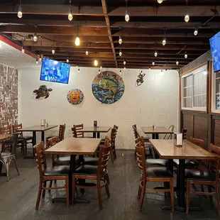 TVs everywhere playing different sports.