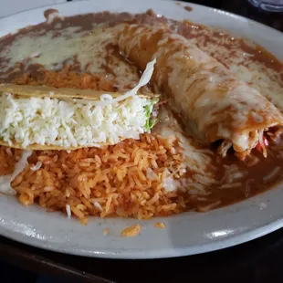Chicken enchilada and beef taco with rice and beans.
