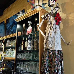 a statue of a skeleton in a mexican restaurant