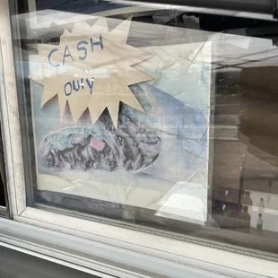 a cash guy sign in a window