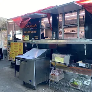 a food truck with food on the counter