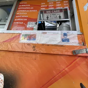 a food truck with a menu on it
