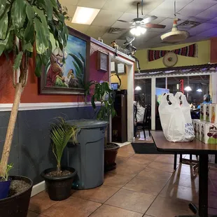Dining area - very dusty ceiling fans, bulky trash cans, bad lighting and smelled like cleaning chemicals.