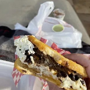 A bite into the arepa