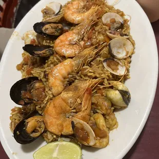 a plate of seafood and rice