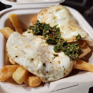 a meal in a styrofoam container