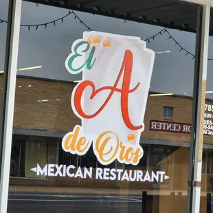a sign in the window of a mexican restaurant