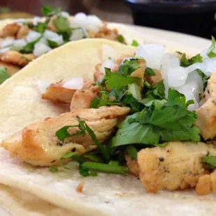 Chicken tacos on corn tortillas wit cilantro &amp; onion :)'