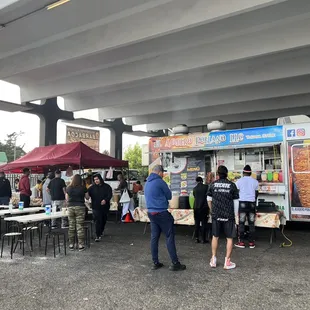 Order/pay at the cart. Then bring your receipt to the food prep line on the left