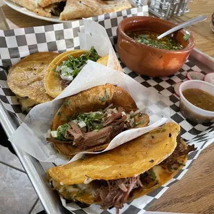 birria sampler platter (top to bottom: mulita, soft taco, dorado taco, quesotaco)