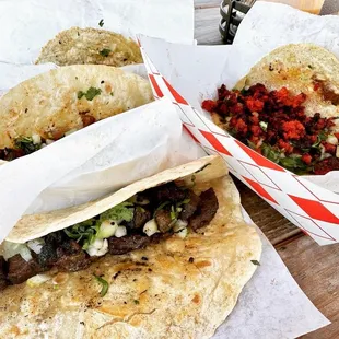 three tacoss on a table