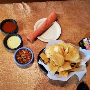 tortilla, salsa, and chips on a table