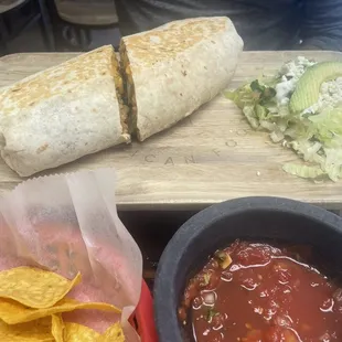 a burrito, salsa, and tortilla