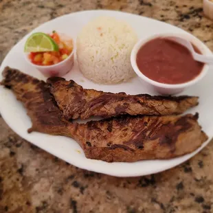 Combo #2 (carne asada); papusas not pictured. This was amazing! So flavorful and tender. Comes with 2 sides.