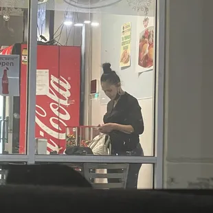 a woman looking at her cell phone