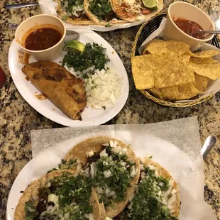 three plates of mexican food