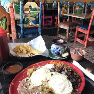 Chilaquiles Verdes with Steak and and extra Egg. Delicious and a large portion.