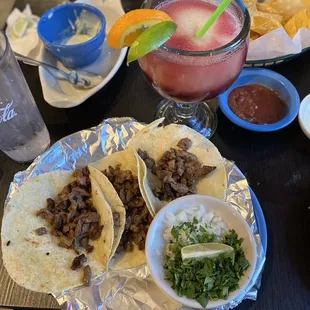 Tacos  de carne asada, the margarita with sangria swirl, chips, salsa, and queso