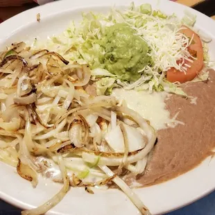 Some kind of chicken and onion thing. Chicken was bland and too thin, and onions were way undercooked.