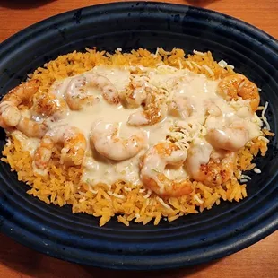 Arroz con Camarón: grilled shrimp on a bed of rice covered in cheese sauce