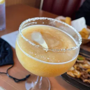 Large peach Margarita with sugar rim