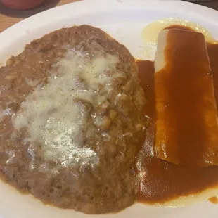 Cheese enchilada with red sauce and refried beans.