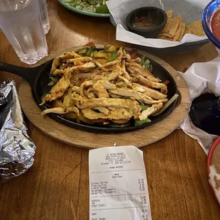 Chicken fajitas and carnitas plate along with the ridiculously priced &quot;cash&quot; receipt