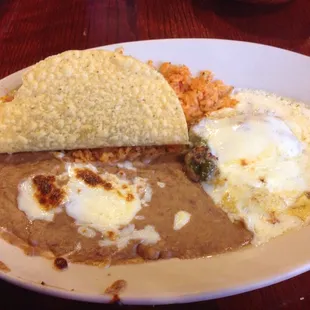 Lunch special 4: taco, chili relleno, rice and beans.