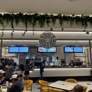 people sitting at tables in a restaurant