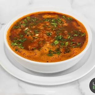 a bowl of soup on a plate