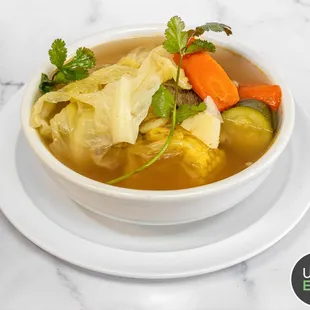 a bowl of soup on a plate