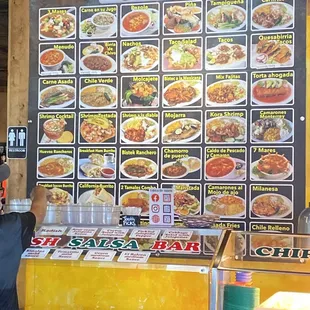 Menu in front of self serve salsa bar