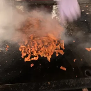 Al pastor getting grilled off the trompo