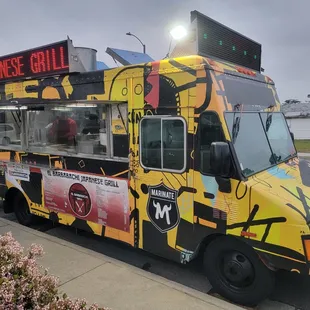 a yellow and black food truck