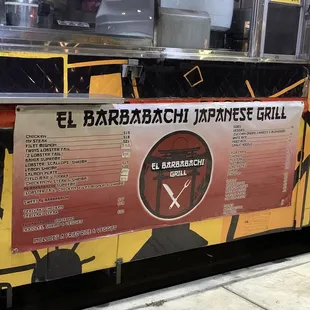 a sign on the side of a food truck