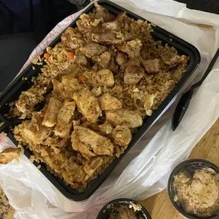 a tray of rice and meat