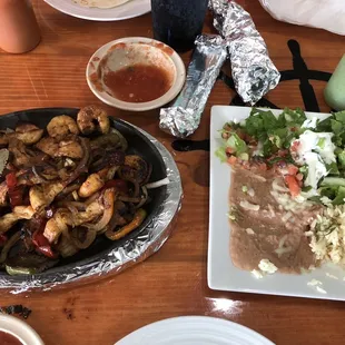 Shrimp and chicken fajitas. Very good. Skimpy fixings plate though there is a tiny bit missing from this one