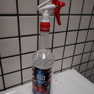  bottle of cleaner on a counter