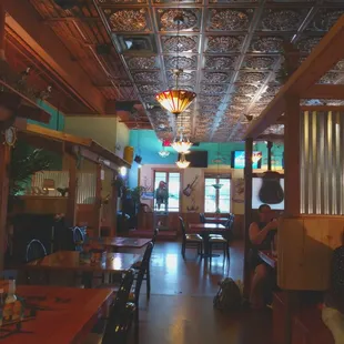 Tin ceiling and clean, roomy space.