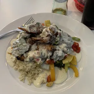 Not on the menu but ask for the lemon tilapia comes with rice , stem veggies , and 2 grilled shrimp with Lemon sauce .