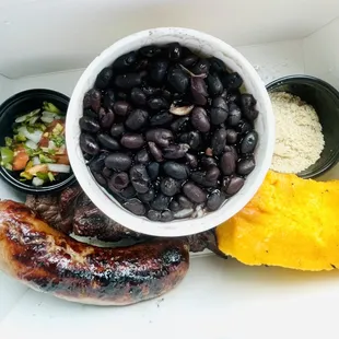 Happy box: picanha steak skewer, sausage with pico de gallo, rice and beans, farofa and cornbread