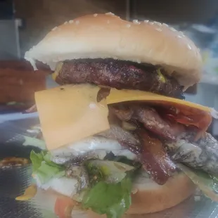 Rodeo Cheeseburger
Cheese burger, ham, bacon, eggs, potato sticks, lettuce, pico de gallo and pickles. 
$7.99
With French Fries
$9.99