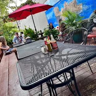 people sitting at a table outside