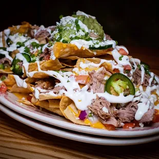 Carnitas Nachos. Ginormous portion for $18. Filling and decent. Fresh jalapeños is what makes me HAPPY!