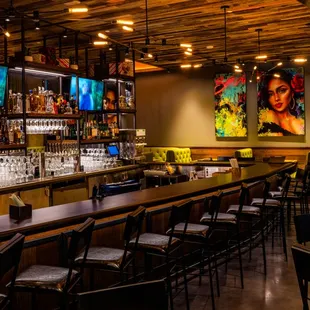 a bar with a lot of chairs