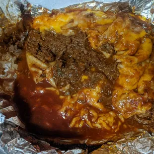 This nasty mess was made by elby&apos;s said it was a burrito don&apos;t waste your money or just go pick up some roadkill